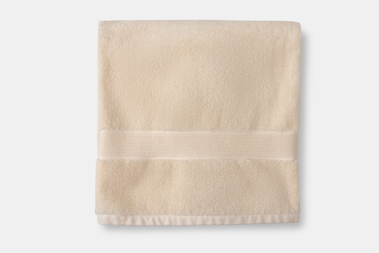 Folded beige organic cotton bath towel for home & garden